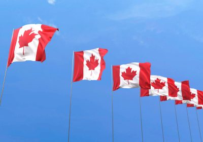 Imagem ilustrativa sobre valor do visto canadense mostrando várias bandeiras do país.